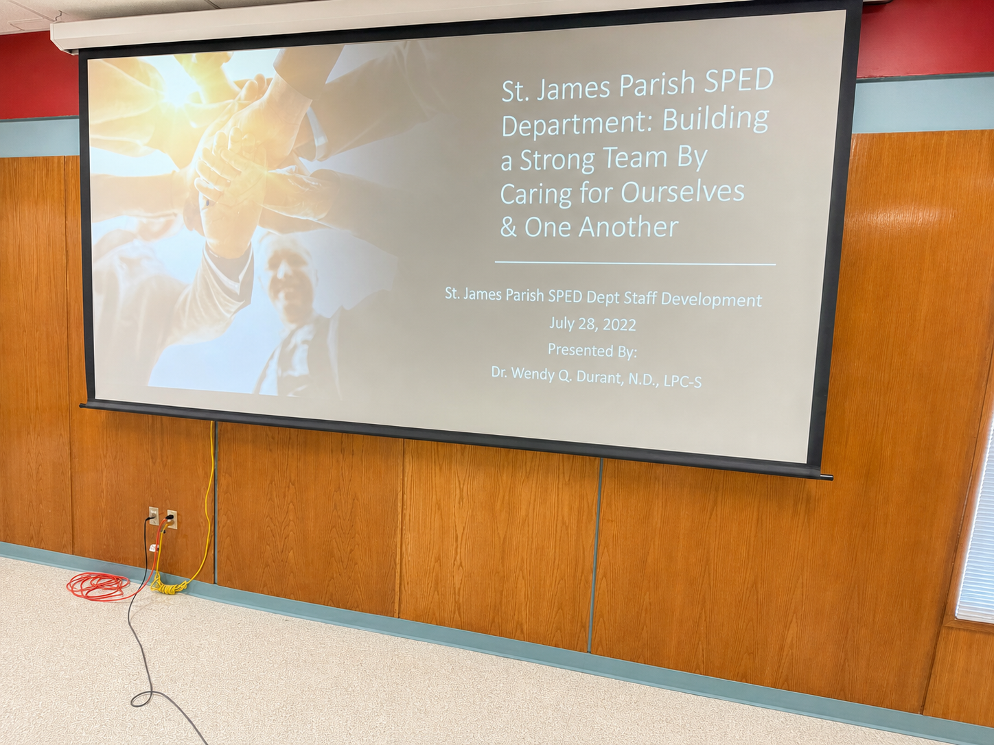 A bright staff-development presentation screen naming Dr. Wendy Q. Durant as the presenter
